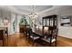 Spacious dining room with hardwood floors, large windows, and a classic chandelier, perfect for entertaining at 2759 Thomashire Trce, Marietta, GA 30066