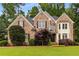 Charming brick home with lush front yard, manicured landscaping, and traditional architectural details at 2759 Thomashire Trce, Marietta, GA 30066