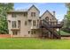 Rear exterior of the house, showcasing a spacious yard and inviting deck at 2759 Thomashire Trce, Marietta, GA 30066