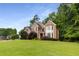 Attractive brick home with a well-maintained lawn and mature landscaping, enhancing its curb appeal at 2759 Thomashire Trce, Marietta, GA 30066