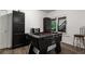 Entertainment space with a foosball table, sleek black cabinets and modern flooring at 2759 Thomashire Trce, Marietta, GA 30066