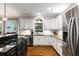 Updated kitchen features stainless steel appliances, granite counters and access to the back yard at 2759 Thomashire Trce, Marietta, GA 30066