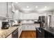 Updated kitchen features stainless steel appliances, granite counters and new flooring at 2759 Thomashire Trce, Marietta, GA 30066