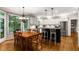 Eat-in kitchen features white cabinetry, stainless steel appliances, black island and a breakfast nook at 2759 Thomashire Trce, Marietta, GA 30066