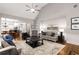 Open concept living room features a vaulted ceiling, fireplace, and flows into the kitchen at 2759 Thomashire Trce, Marietta, GA 30066