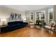 Stylish living room featuring hardwood floors, a bay window, and contemporary decor at 2759 Thomashire Trce, Marietta, GA 30066