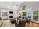 Spacious living room boasts vaulted ceilings, a fireplace, built-in shelving and lots of natural light at 2759 Thomashire Trce, Marietta, GA 30066