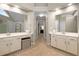 Bright bathroom featuring double sinks, white cabinets, and tile flooring at 2759 Thomashire Trce, Marietta, GA 30066