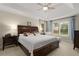 Spacious main bedroom with tray ceiling, a large window, and neutral decor at 2759 Thomashire Trce, Marietta, GA 30066