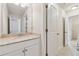 Bathroom with a vanity featuring a granite countertop, and a view into an adjacent bathroom at 3182 Hartford Mill Pl, Duluth, GA 30097
