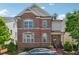 Charming brick front home with manicured landscaping and a welcoming entrance at 3182 Hartford Mill Pl, Duluth, GA 30097