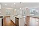 Gourmet kitchen with a large island, stainless steel appliances, and hardwood flooring at 3182 Hartford Mill Pl, Duluth, GA 30097