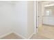 Walk-in closet with shelving, and a view into an adjacent bathroom at 3182 Hartford Mill Pl, Duluth, GA 30097