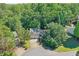 Aerial view of a beautiful home surrounded by lush green trees at 804 Rose Creek Walk, Woodstock, GA 30189