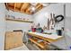 Unfinished basement with workbench and pegboard for ample storage space at 804 Rose Creek Walk, Woodstock, GA 30189