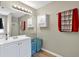 Bathroom featuring a spacious vanity, large mirror, and modern lighting fixtures at 804 Rose Creek Walk, Woodstock, GA 30189