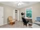 Cozy bedroom with natural light, desk, chair and closet space at 804 Rose Creek Walk, Woodstock, GA 30189