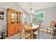 Charming dining room with hardwood floors, a stylish chandelier, and a hutch perfect for displaying your dishware at 804 Rose Creek Walk, Woodstock, GA 30189
