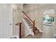 Inviting foyer with hardwood floors, staircase, and access to the living areas, creating a welcoming entrance to the home at 804 Rose Creek Walk, Woodstock, GA 30189