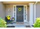 Inviting front door features a decorative wreath and potted plants at 804 Rose Creek Walk, Woodstock, GA 30189