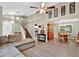 Bright and airy living room with vaulted ceiling, hardwood floors, and an open layout leading to the dining area and kitchen at 804 Rose Creek Walk, Woodstock, GA 30189