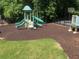 Community playground featuring slides, a basketball hoop, and mature landscaping at 804 Rose Creek Walk, Woodstock, GA 30189