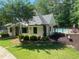 Exterior of the community pool house near the pool surrounded by green lawn at 804 Rose Creek Walk, Woodstock, GA 30189