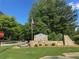 Rose Creek subdivision entrance sign surrounded by beautiful landscaping at 804 Rose Creek Walk, Woodstock, GA 30189