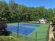 Well-maintained community tennis courts with trees in the background at 804 Rose Creek Walk, Woodstock, GA 30189