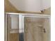 Updated tiled bathroom with modern glass shower and fixtures at 900 Ellesmere Pt, Mcdonough, GA 30253