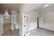 Bright entryway with white trim, light wood floors, and decorative French doors leading to additional rooms at 900 Ellesmere Pt, Mcdonough, GA 30253