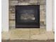 Stone fireplace featuring a stone hearth and white pillars at 900 Ellesmere Pt, Mcdonough, GA 30253