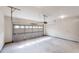 This is a standard two-car garage featuring an automatic door and concrete floor at 900 Ellesmere Pt, Mcdonough, GA 30253