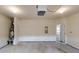 Two car garage with painted walls and standard garage door, door to inside house at 900 Ellesmere Pt, Mcdonough, GA 30253