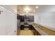 Kitchen with dark cabinetry and a breakfast bar at 900 Ellesmere Pt, Mcdonough, GA 30253