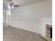 Living room with a ceiling fan and fireplace with hardwood floors at 900 Ellesmere Pt, Mcdonough, GA 30253