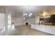 Spacious living room with a fireplace, hardwood floors and an open kitchen at 900 Ellesmere Pt, Mcdonough, GA 30253