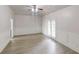 Spacious living room with wood floors, detailed wainscoting, and double glass doors to the outside at 900 Ellesmere Pt, Mcdonough, GA 30253