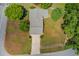 Aerial view of property with a paved driveway and well-maintained landscaping with white fencing at 2584 Gravitt Rd, Duluth, GA 30096