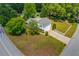 Spacious property featuring a well-maintained lawn and a classic white picket fence at 2584 Gravitt Rd, Duluth, GA 30096