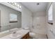 Clean bathroom with a vanity, large mirror, tub/shower combo, and tile flooring at 2584 Gravitt Rd, Duluth, GA 30096