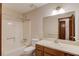 Full bathroom featuring a vanity with a mirror, a toilet, and a shower/tub with a shower curtain at 2584 Gravitt Rd, Duluth, GA 30096