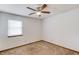 Neutral bedroom featuring carpet, ceiling fan, and a large window at 2584 Gravitt Rd, Duluth, GA 30096