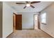 Bedroom with carpet, neutral walls, ceiling fan, and access to ensuite bathroom at 2584 Gravitt Rd, Duluth, GA 30096