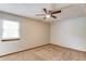 Comfortable bedroom with neutral carpet and ceiling fan, bathed in natural light at 2584 Gravitt Rd, Duluth, GA 30096