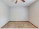 Neutral carpeted bedroom with ceiling fan and three walls painted white, with one electrical outlet visible at 2584 Gravitt Rd, Duluth, GA 30096