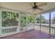 Enclosed porch with a ceiling fan, views of the yard, and screen doors for access at 2584 Gravitt Rd, Duluth, GA 30096