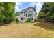 Spacious backyard features a multi-tiered deck and ample green space for outdoor activities and entertaining at 3014 Volland Grove Trail, Lawrenceville, GA 30043