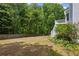 Expansive backyard with a wooden fence, greenery, and garden offering a private outdoor space at 3014 Volland Grove Trail, Lawrenceville, GA 30043