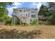Large backyard with a deck and stairs, perfect for outdoor entertaining and enjoying the natural surroundings at 3014 Volland Grove Trail, Lawrenceville, GA 30043